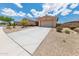 Charming single-story home with a well-maintained yard and spacious two-car garage at 15248 S 182Nd Ln, Goodyear, AZ 85338