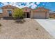Charming single-story home with a well-maintained yard and spacious two-car garage at 15248 S 182Nd Ln, Goodyear, AZ 85338