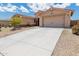 Charming single-story home with a well-maintained yard and spacious two-car garage at 15248 S 182Nd Ln, Goodyear, AZ 85338