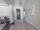 Inviting foyer with tile floors, a stylish light fixture, and a decorative art piece at 15248 S 182Nd Ln, Goodyear, AZ 85338