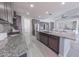 Open kitchen layout with an island, stainless steel appliances and granite countertops at 15248 S 182Nd Ln, Goodyear, AZ 85338