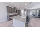 Gourmet kitchen featuring a large island with seating, and modern stainless-steel appliances at 15248 S 182Nd Ln, Goodyear, AZ 85338