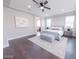 Spacious main bedroom offers a serene retreat with a plush bed, soft rug, and stylish decor at 15248 S 182Nd Ln, Goodyear, AZ 85338