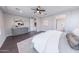Beautiful main bedroom showcasing hardwood floors, a dresser, and an ensuite bathroom entrance at 15248 S 182Nd Ln, Goodyear, AZ 85338