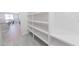 Spacious walk-in pantry with ample shelving, providing plenty of storage space at 15248 S 182Nd Ln, Goodyear, AZ 85338