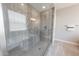 Modern glass shower with sleek gray tiling, providing a spa-like experience in the bathroom at 15248 S 182Nd Ln, Goodyear, AZ 85338