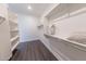 Bright walk-in closet with efficient storage solutions including shelves and rods for organized living at 15248 S 182Nd Ln, Goodyear, AZ 85338