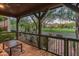 Inviting covered patio with stone flooring, providing serene views of the green neighborhood at 17728 N 92Nd Pl, Scottsdale, AZ 85255