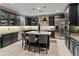 Stylish kitchen with stainless steel appliances, a large island, and pendant lighting at 17728 N 92Nd Pl, Scottsdale, AZ 85255