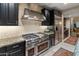 Gourmet kitchen boasts stainless steel appliances, granite counters, and a professional-grade range at 17728 N 92Nd Pl, Scottsdale, AZ 85255