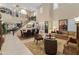 Spacious living room with tall ceilings, grand staircase, and plenty of natural light at 17728 N 92Nd Pl, Scottsdale, AZ 85255
