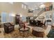 Bright living room with soaring ceilings, decorative rugs, and ample seating at 17728 N 92Nd Pl, Scottsdale, AZ 85255