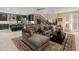 Expansive living area blending seamlessly with the kitchen, featuring a large sectional and stylish decor at 17728 N 92Nd Pl, Scottsdale, AZ 85255