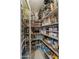 Walk-in pantry provides ample storage space with organized shelving and clear containers for easy access at 17728 N 92Nd Pl, Scottsdale, AZ 85255