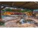 Backyard oasis with a pool, hot tub, waterfall feature, a pergola and comfortable seating at 17728 N 92Nd Pl, Scottsdale, AZ 85255