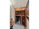 Custom wine storage with built-in wine cooler and wooden racks for ample bottle capacity at 17728 N 92Nd Pl, Scottsdale, AZ 85255