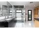 Modern bathroom boasting marble floors, a glass-enclosed shower, double sinks, and decorative mirrors at 1861 W Navarro Ave, Mesa, AZ 85202
