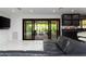 Spacious living room featuring large sliding doors leading to the patio and stylish black accents at 1861 W Navarro Ave, Mesa, AZ 85202