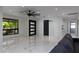 Stylish living room with sleek tile, modern fixtures, and an open layout for versatile living spaces at 1861 W Navarro Ave, Mesa, AZ 85202