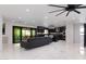 Expansive open-concept living area featuring marble floors, modern lighting, and seamless outdoor access at 1861 W Navarro Ave, Mesa, AZ 85202