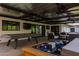 Enjoy outdoor living with a stylish pool table, cozy hot tub, and comfortable lounge seating at 1861 W Navarro Ave, Mesa, AZ 85202