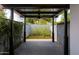 Relax on this covered patio, perfect for outdoor entertaining, with its stylish design and lush greenery at 1861 W Navarro Ave, Mesa, AZ 85202
