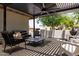 Inviting outdoor patio with stylish furniture under a modern pergola for comfortable lounging at 1861 W Navarro Ave, Mesa, AZ 85202