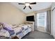 Comfortable bedroom with a ceiling fan, view of ocean, and a cozy quilt on the bed at 20443 N 97Th Ave, Peoria, AZ 85382