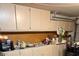 Garage with storage cabinets and working space at 20443 N 97Th Ave, Peoria, AZ 85382