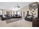 Spacious living room offers comfortable seating and great natural light from the back windows at 20443 N 97Th Ave, Peoria, AZ 85382