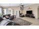 Living room features tile floors, a ceiling fan, and a view to the backyard at 20443 N 97Th Ave, Peoria, AZ 85382