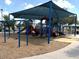 Community playground with swings and slides and canopy at 20443 N 97Th Ave, Peoria, AZ 85382