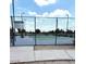 Community tennis court behind chain link fence at 20443 N 97Th Ave, Peoria, AZ 85382