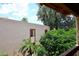 Balcony view features lush landscaping and mature trees overlooking the community at 205 N 74Th St # 248, Mesa, AZ 85207