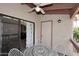 View of balcony with a white table and chair set, as well as access to an indoor living space at 205 N 74Th St # 248, Mesa, AZ 85207