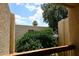 Balcony view of the building exterior and nearby foliage offer a serene outdoor retreat at 205 N 74Th St # 248, Mesa, AZ 85207