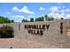 Welcome to Sunvalley Villas! Beautiful community sign surrounded by lush desert landscaping at 205 N 74Th St # 248, Mesa, AZ 85207