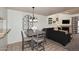 Cozy dining area adjacent to the living room, showcasing stylish furnishings and decor at 205 N 74Th St # 248, Mesa, AZ 85207