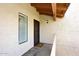 Private condo entry featuring a black security door, exterior light and window with blinds at 205 N 74Th St # 248, Mesa, AZ 85207