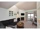Inviting living room featuring a fireplace, balcony access, and soaring vaulted ceilings at 205 N 74Th St # 248, Mesa, AZ 85207