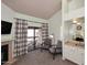 Living room with fireplace, balcony, and wet bar offers comfortable relaxation at 205 N 74Th St # 248, Mesa, AZ 85207