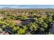 Scenic aerial view of the community park surrounded by lush trees and neighborhood homes at 20866 W Werner Pl, Buckeye, AZ 85396