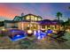 Beautiful backyard featuring a pool, spa, fire features, and covered patio, perfect for entertaining at 20866 W Werner Pl, Buckeye, AZ 85396