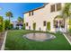 Spacious backyard with pristine artificial turf and a sunken trampoline, perfect for outdoor activities at 20866 W Werner Pl, Buckeye, AZ 85396