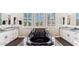 Modern bathroom showcasing a luxurious black soaking tub, white cabinetry, and sleek fixtures at 20866 W Werner Pl, Buckeye, AZ 85396