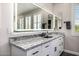 Bathroom vanity features a granite countertop, undermount sink, and modern lighting at 20866 W Werner Pl, Buckeye, AZ 85396