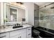 Contemporary bathroom with a granite countertop, a black sink, and a glass door shower at 20866 W Werner Pl, Buckeye, AZ 85396