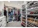 Walk-in closet with ample shelving and storage for clothing, shoes, and accessories at 20866 W Werner Pl, Buckeye, AZ 85396