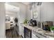 Chic coffee bar area with granite countertop, wine fridge, and coffee machine at 20866 W Werner Pl, Buckeye, AZ 85396