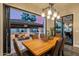 Indoor dining with large windows, great views and a decorative chandelier at 20866 W Werner Pl, Buckeye, AZ 85396